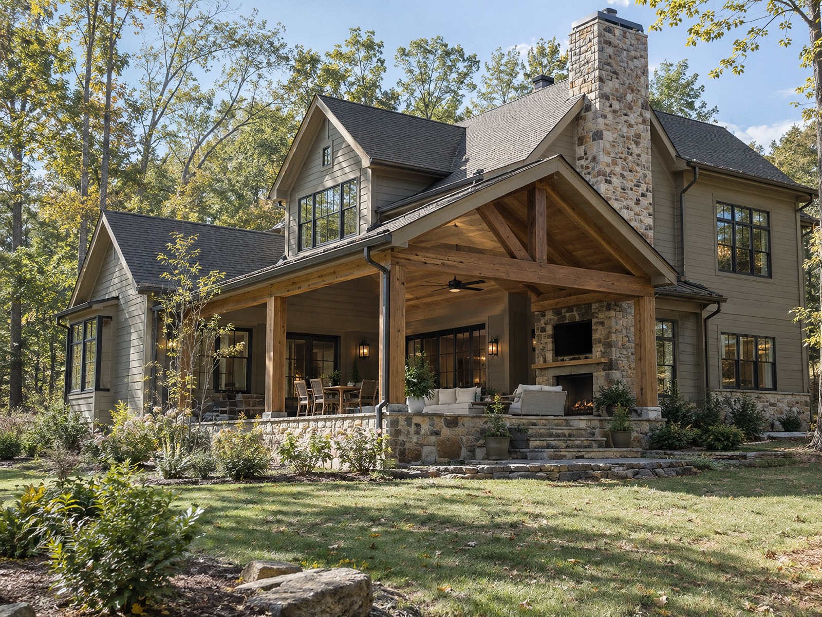 Custom timber and stone home with a covered outdoor room
